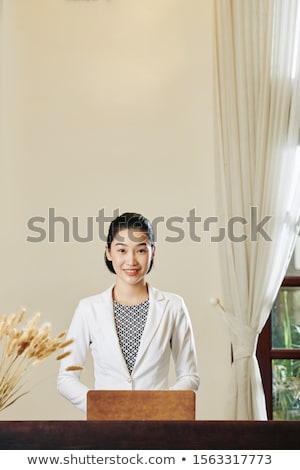 Stock fotó: Portrait Of A Pretty Young Woman Standing At Modern Resort And L