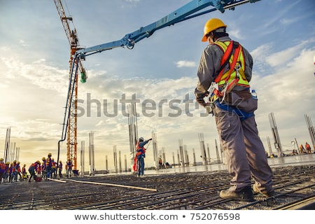 Stock photo: A Male Construction Worker Sitting On The Floor