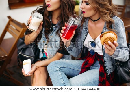 Stock photo: Beautiful Girlfriends With Make Up Eating In Fast Food Cafe