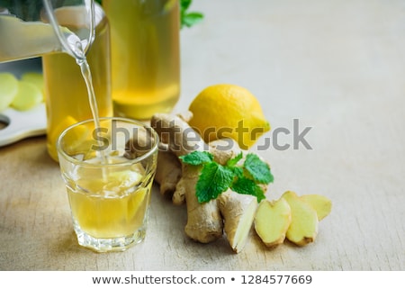 Foto stock: Detox Water In Bottles With Ingredients Ginger Lemon Mint