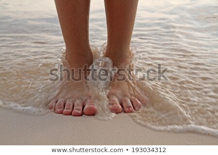 Stock fotó: Bare Human Feet On Sand Beach