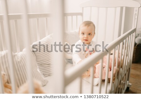 Girl In A Cradle Among The Pillows Stok fotoğraf © Stasia04