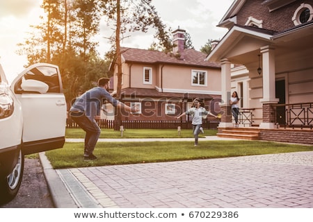 Stok fotoğraf: Mother And Daughter Standing On Porch