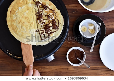 Stockfoto: Freshly Prepared Crepes With Chocolate Sauce