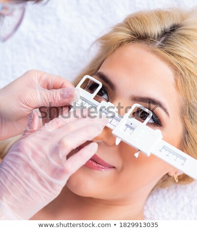 Stock fotó: Female Ophthalmologist Is Checking Up Female Patient In Eye Doct