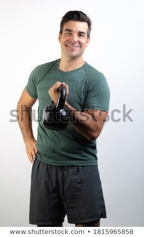 Foto d'archivio: Handsome Man Working With Kettlebell On White