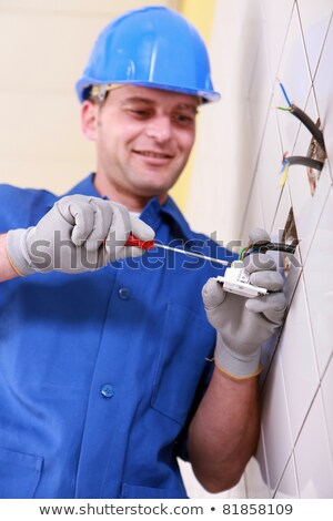 Stock photo: Electrician Wiring A Continental Wall Socket