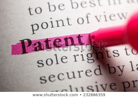 Stok fotoğraf: The Word Patent Highlighted In A Dictionary