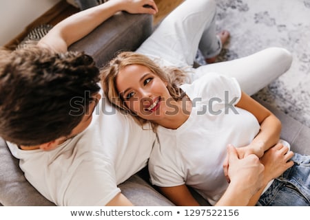 Stock foto: Man Looking At His Girlfriend And Holding Her Close