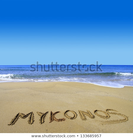 Foto stock: Word Beach Written In Sand At Greek Sea