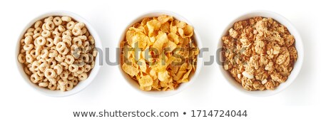 Foto d'archivio: Corn Flakes Closeup Pattern On White Background Top View Cereals Texture