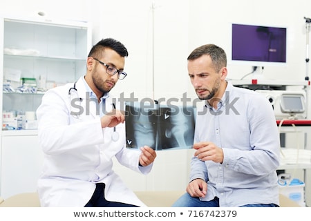 Сток-фото: Doctor Showing Knee X Ray To Patient