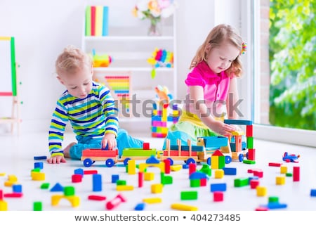 ストックフォト: A Creative Kindergarten Kids Build A Block Tower