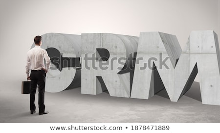 Zdjęcia stock: Rear View Of A Businessman Standing In Front Abbreviation