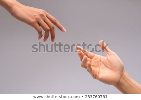 Foto stock: Man And Woman Touching Fingers Isolated