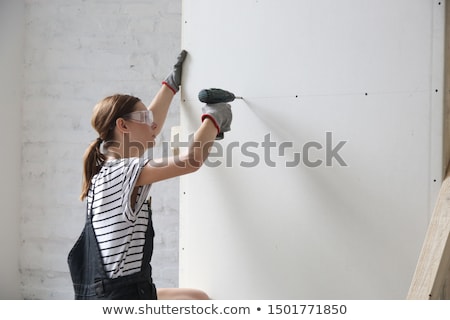 [[stock_photo]]: Woman With A Drill