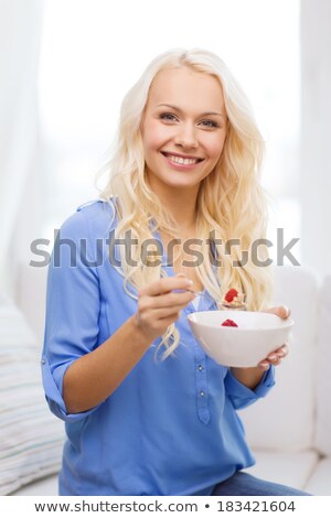 ストックフォト: Smiling Woman Holding Bowl Of Grains