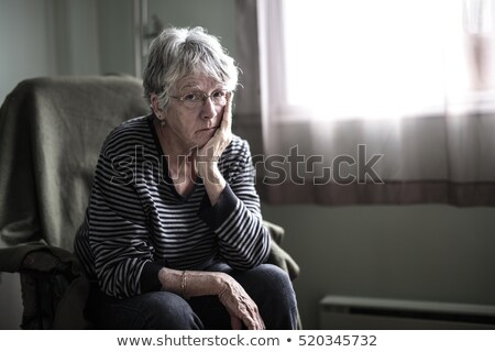 Foto stock: Worried Senior Woman At Home Felling Very Bad