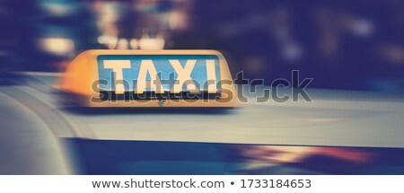 Stok fotoğraf: Black And Yellow Taxi Sign