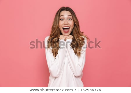 Foto stock: Portrait Of An Excited Young Casual Girl Screaming