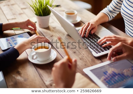 Zdjęcia stock: Group Of People With Devices In Hands Working On Laptops And Tablets