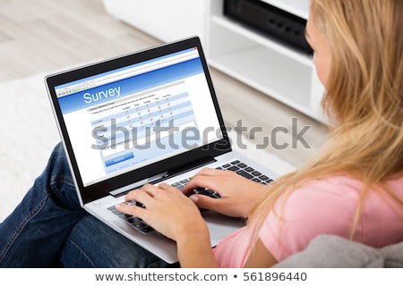 Сток-фото: Woman Looking At Online Survey Laptop Computer