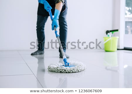 Young Housekeeper Or Washing Cleaning Floor At Mop In Protective Сток-фото © Freedomz