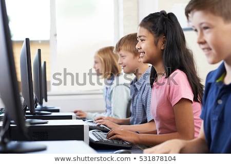 Zdjęcia stock: Group Of Female Elementary School Children In Computer Class