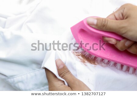 Zdjęcia stock: Young Woman With Spray Bottle And Stained Shirt