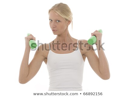 [[stock_photo]]: Ortrait · d'une · jeune · femme · de · race · blanche · qui · s'entraîne · avec · des · haltères · à · la · main