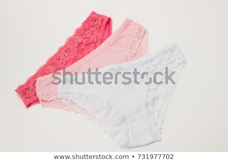 Foto stock: Pink Panties On The Green Background