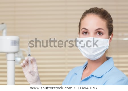 Stock photo: Serious Dental Assistant Looking At Camera