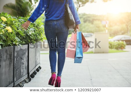ストックフォト: Unrecognizable Female Touching Street Plants After Shopping