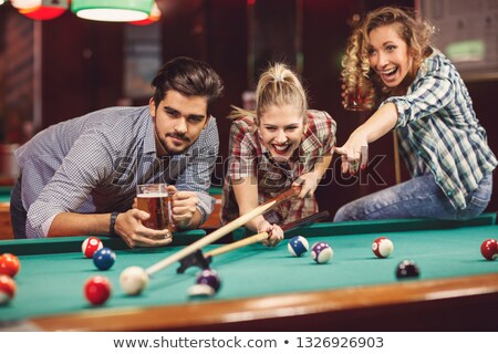 Stock fotó: Young People Playing Snooker In A Club Pub Bar