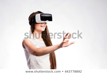 ストックフォト: Digital Composite Of Woman With A Virtual Reality Simulator Against Close Up Of Pixelated Gray 3d Ma