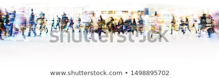 Zdjęcia stock: Businessman Walking On A Crowded Street