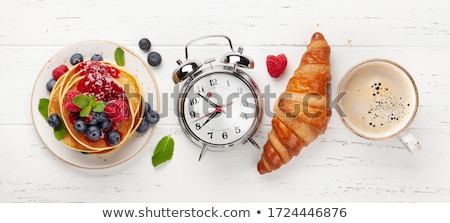 Foto stock: Delicious Pancakes With Berries And Jam Croissants And Coffee