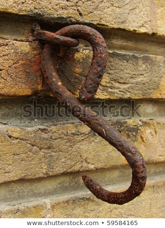 Stok fotoğraf: Very Rusty Metal Hook Attached To A Wall