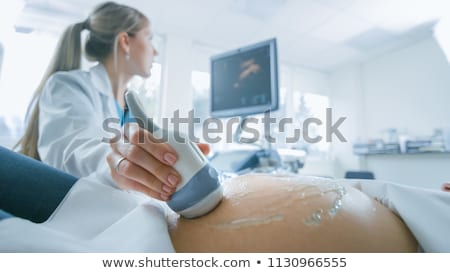 Stock foto: Pregnant With Ultrasounds