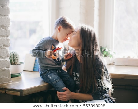 Stok fotoğraf: Cheerful Mother Of The Boy Child