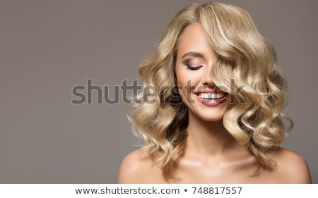 Stock photo: Portrait Of A Beautiful Woman With Long Brown Hair On Gray Backround