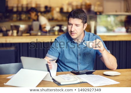 Zdjęcia stock: Businessman Calculating His Business Cash Flow