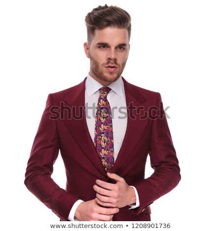 Stock fotó: Man In Suit Holding Palms Together While Looking To Side