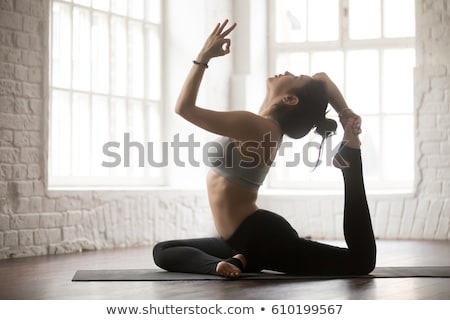 Zdjęcia stock: Portrait Of A Beautiful Young Woman Doing Yoga Exercises