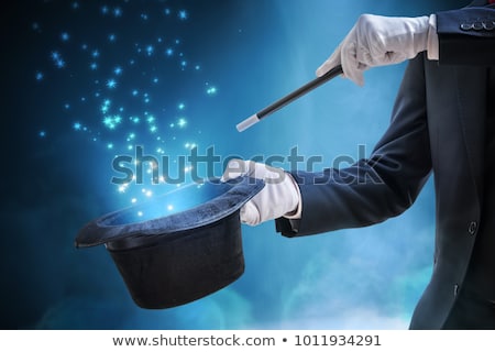 Foto stock: Magicians Hand With Wand And Hat