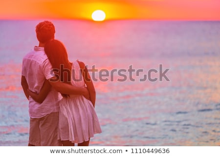 Foto d'archivio: Couple Relaxing On Summer Vacation Travel Standing On Beach Watching Sunset In Tropical Destination