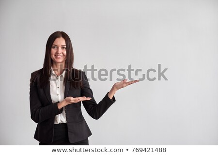 Сток-фото: Smiling Businesswoman Pointing To Something