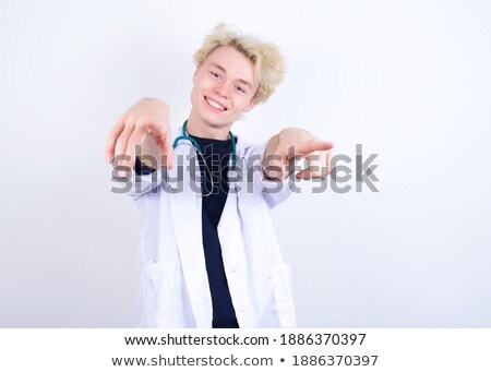 Zdjęcia stock: Portrait Of A Male Doctor Showing Finger At You On White