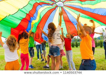 Stock photo: Child Plays On Playground And Is Smiling