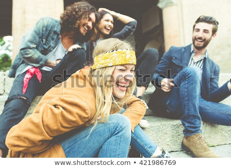 Foto stock: Four Friends Posing Outdoors